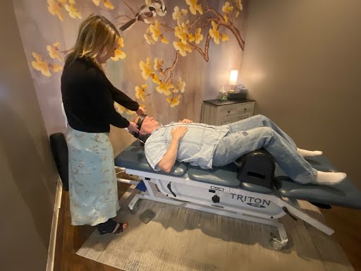 Patient receiving spinal decompression treatment at Restore